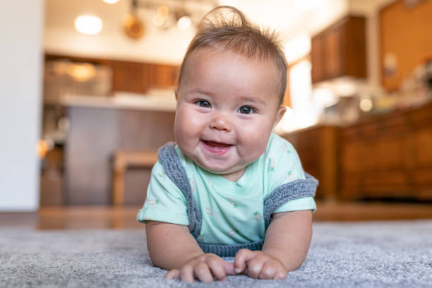 Baby laying on carpet floorings | Flemington Department Store