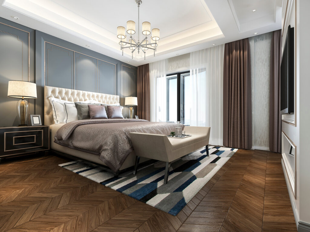 Patterned area rug in a stylish bedroom with hardwood flooring | Flemington Department Store